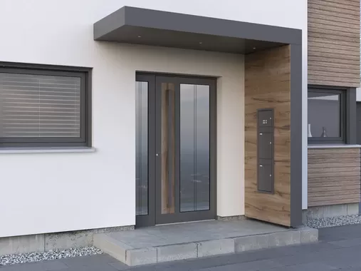 Moderne Kompotherm Haustür mit Holz-Details und passendem Vordach